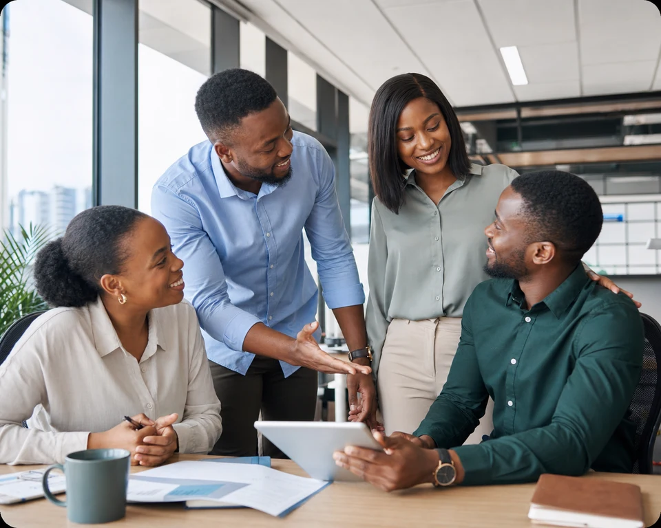 Nigerian professionals welcoming a new teammate at a collaborative office session